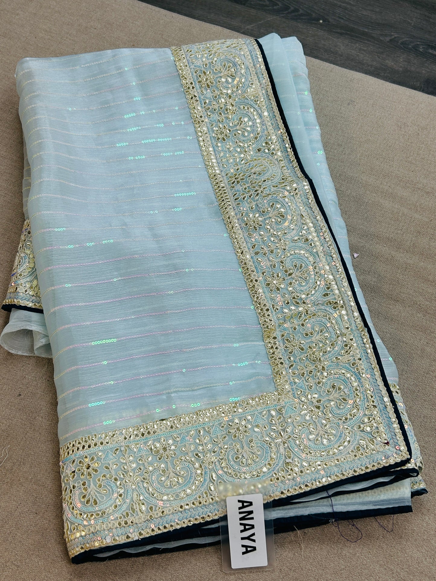 Tissue silk saree with contrast blouse piece