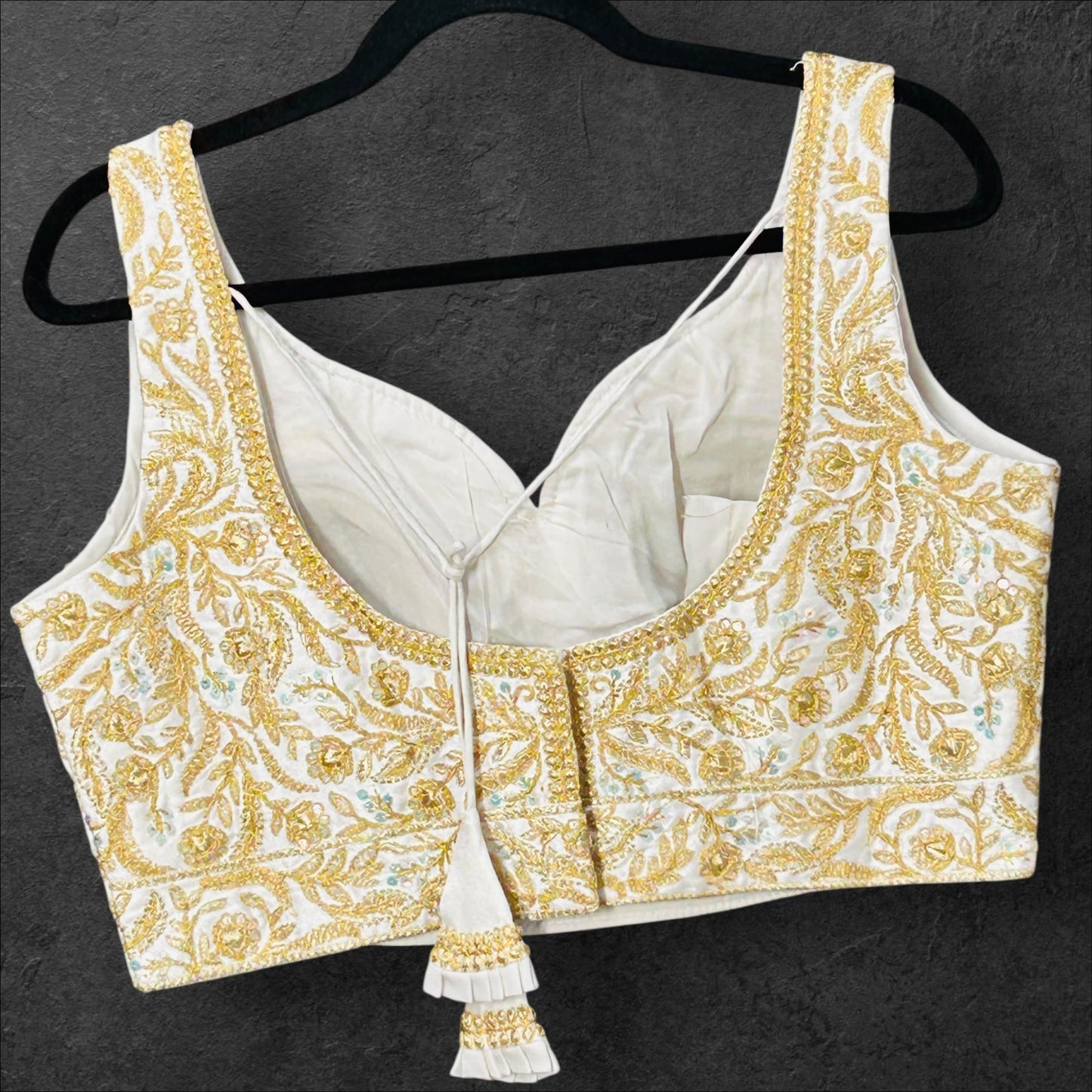 White blouse with gold embroidery