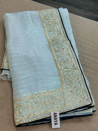 Tissue silk saree with contrast blouse piece