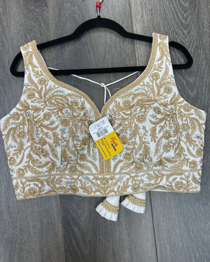White blouse with gold embroidery
