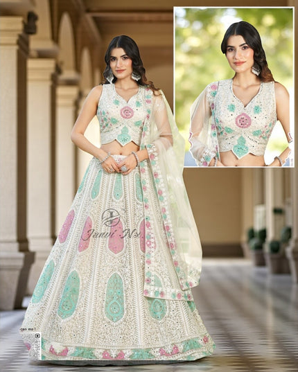 White lehenga choli set with pastel mint and pink embroidery, sleeveless blouse and sheer dupatta.