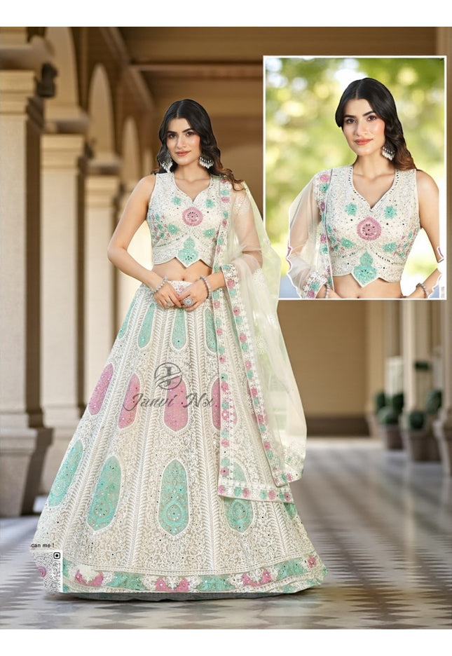 White lehenga choli set with pastel mint and pink embroidery, sleeveless blouse and sheer dupatta.