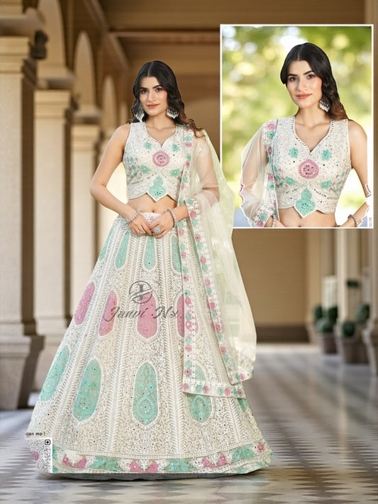 White lehenga choli set with pastel mint and pink embroidery, sleeveless blouse and sheer dupatta.
