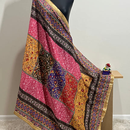 Malai silk dupatta with colorful patchwork and gold border, draped on mannequin