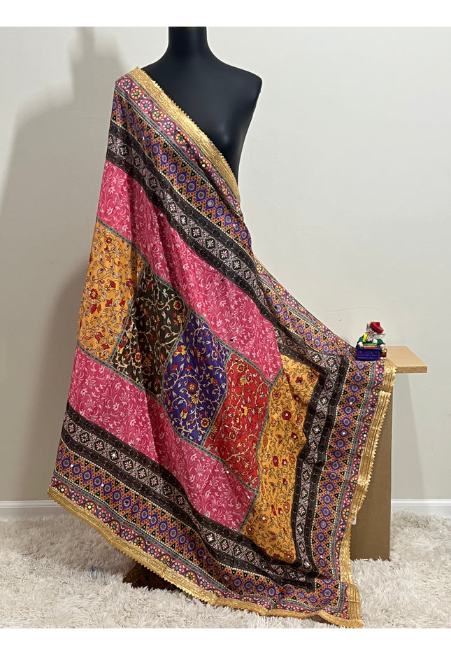 Malai silk dupatta with colorful patchwork and gold border, draped on mannequin
