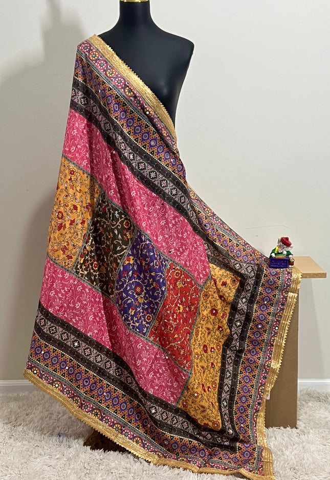 Malai silk dupatta in vibrant patchwork with a gold border, draped over a mannequin.