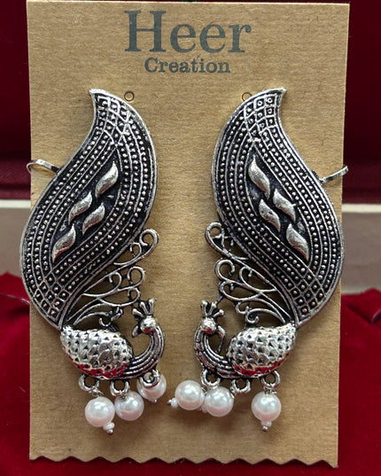 Peacock earrings: earcuffs