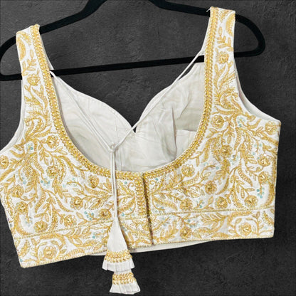 White blouse with gold embroidery