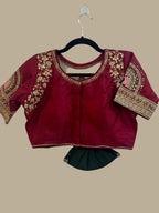 House Of Indian Wedding Attire maroon silk-like blouse with gold embroidery and matching dark green skirt.