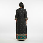 Kurti Connection USA black maxi dress with all-over print, embroidered neckline, and contrasting border detail.