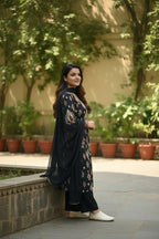 Kurti Connection USA black printed kurta with pants and dupatta set, featuring intricate neckline detailing and a sheer dupatta.