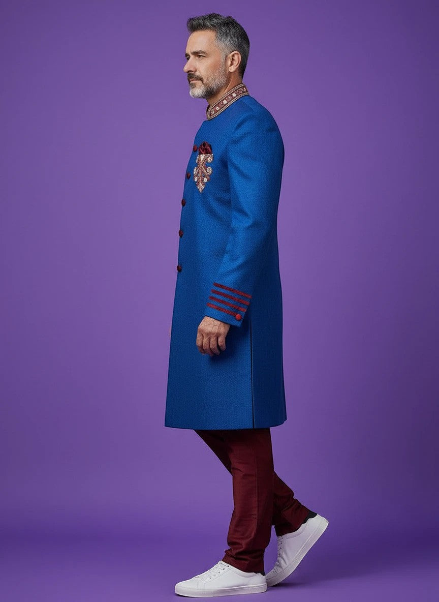 Kurti Connection USA blue sherwani jacket with red velvet accents, mandarin collar, and embroidery on purple background