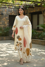 Kurti Connection USA cream botanical print kurta set with V-neck, lace trim, and matching dupatta and trousers.