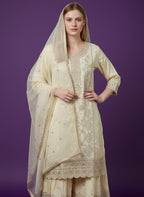 Kurti Connection USA cream silk blend kurti sharara set with silver embroidery and sequin dupatta.