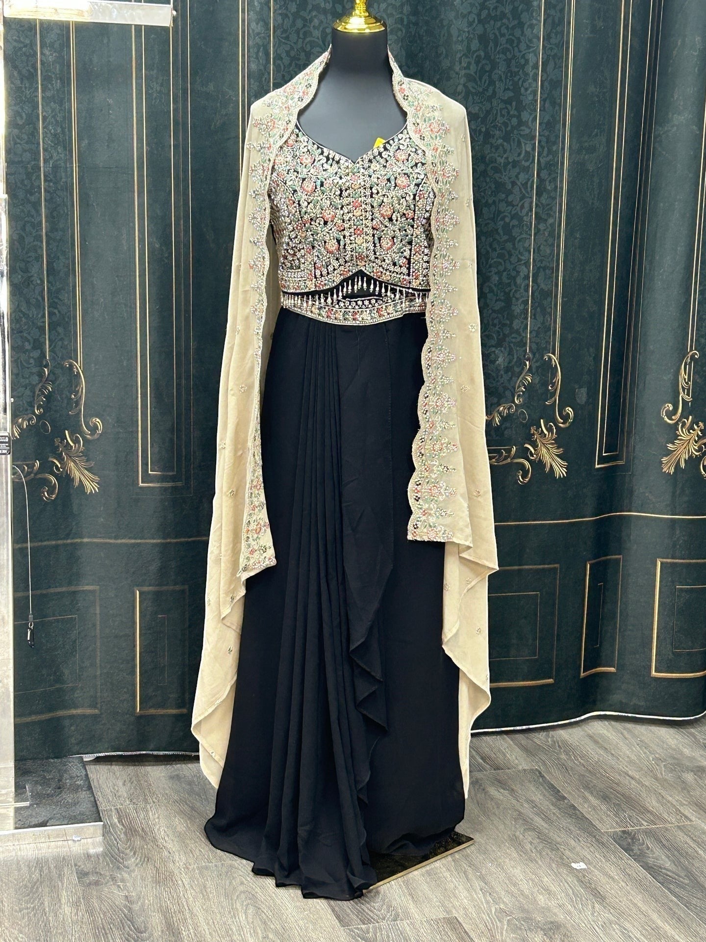 Kurti Connection USA black ethnic gown with floral embroidered bodice and sheer neutral cape on a mannequin