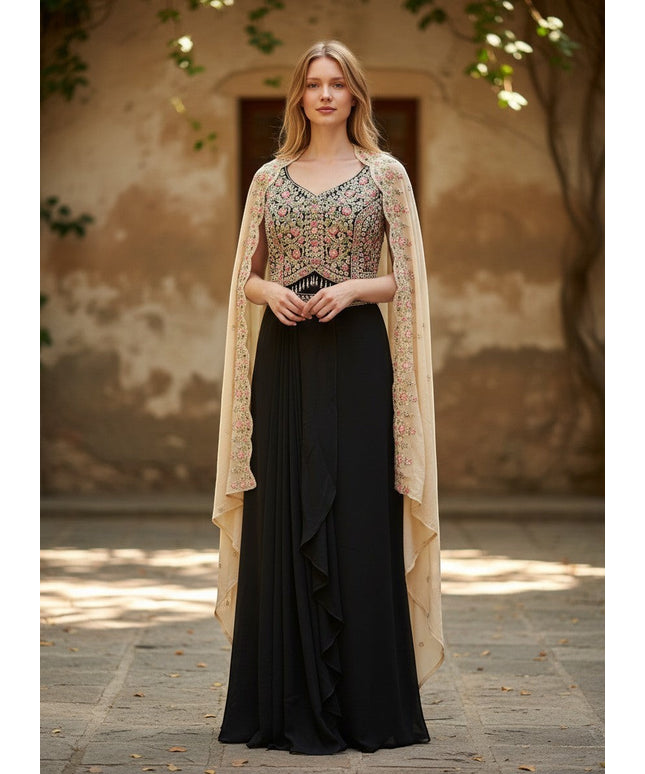 Kurti Connection USA black ethnic gown with floral embroidered bodice and sheer neutral cape worn by a blonde model