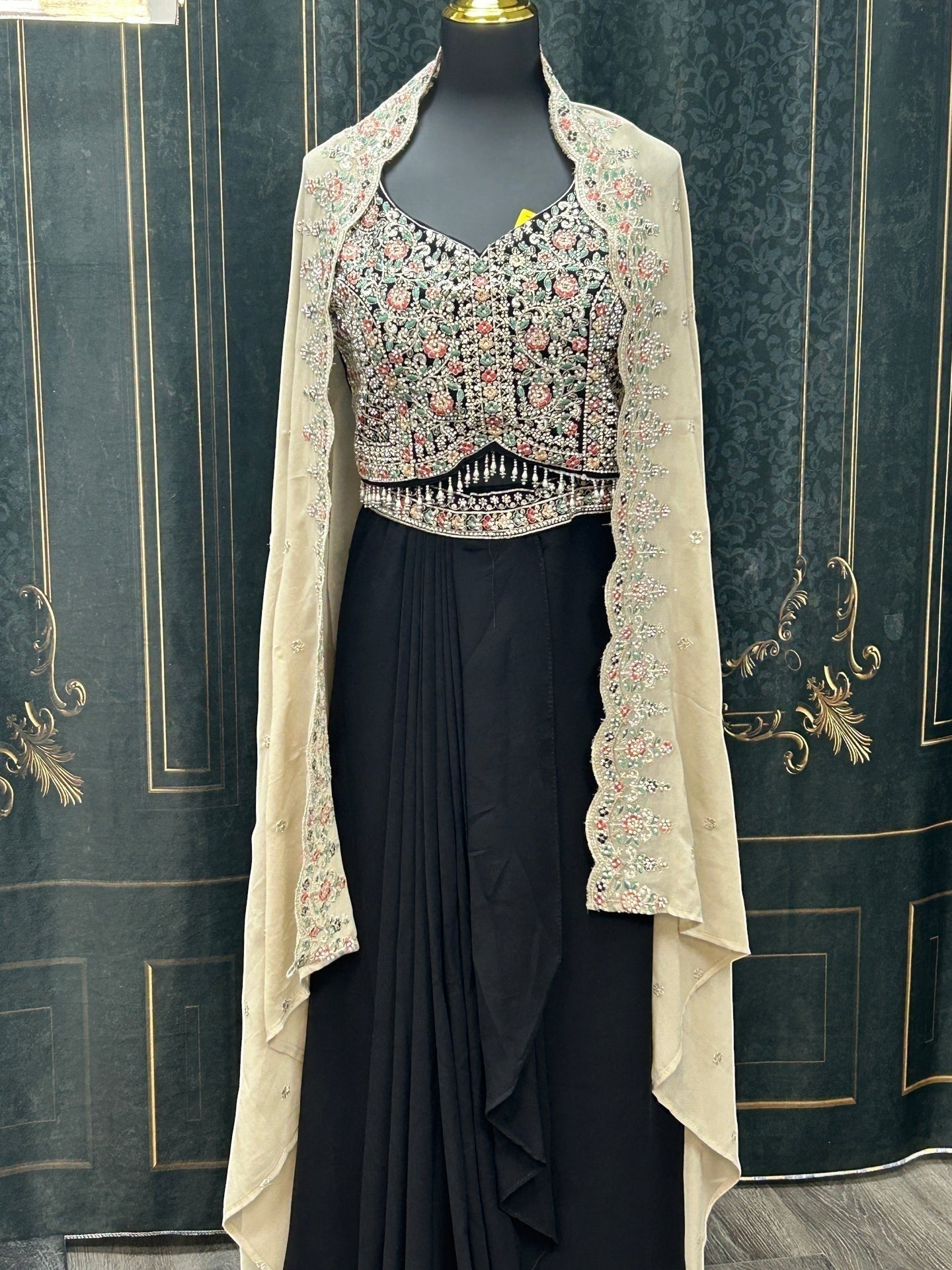 Kurti Connection USA black ethnic gown with floral embroidered bodice and sheer neutral cape on a mannequin