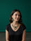 Kurti Connection USA emerald green doublet stone necklace and earring set worn by a woman in a black top