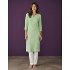 Kurti Connection USA light green textured cotton kurti with 3/4 sleeves and a V-neck, paired with white trousers.