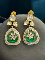 Kurti Connection USA elegant teardrop earrings featuring deep green stones, floral motifs, and white crystal halos.