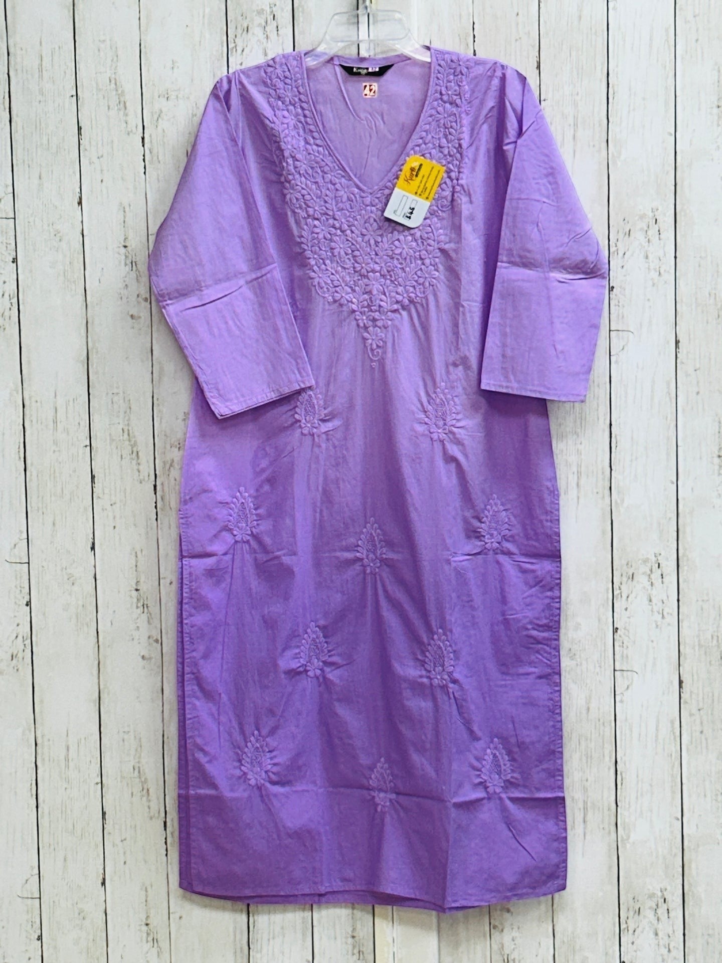 Kurti Connection USA lavender cotton tunic with white floral embroidery, V-neckline, and three-quarter sleeves.