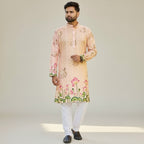 Kurti Connection USA men's peach floral print kurta with white pants. Mandarin collar, button-down front, lotus motif.