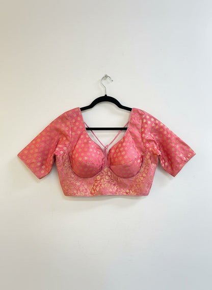 Kurti Connection USA pink brocade blouse with gold floral pattern, sweetheart neckline, criss-cross back, and short sleeves.