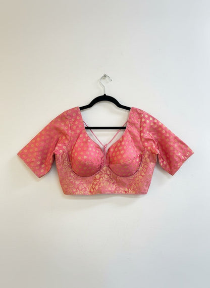 Kurti Connection USA pink brocade blouse with gold floral pattern, sweetheart neckline, criss-cross back, and short sleeves.