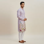 Kurti Connection USA light purple silk kurta set with intricate peacock and deer embroidery, paired with white pajama.
