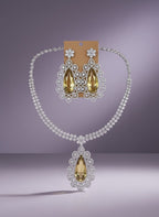 Kurti Connection USA statement necklace set with teardrop yellow stones and clear cubic zirconia, matching drop earrings.