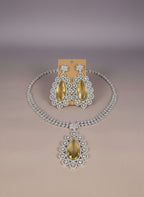 Kurti Connection USA statement necklace set with teardrop yellow stones and clear cubic zirconia in silver tone.