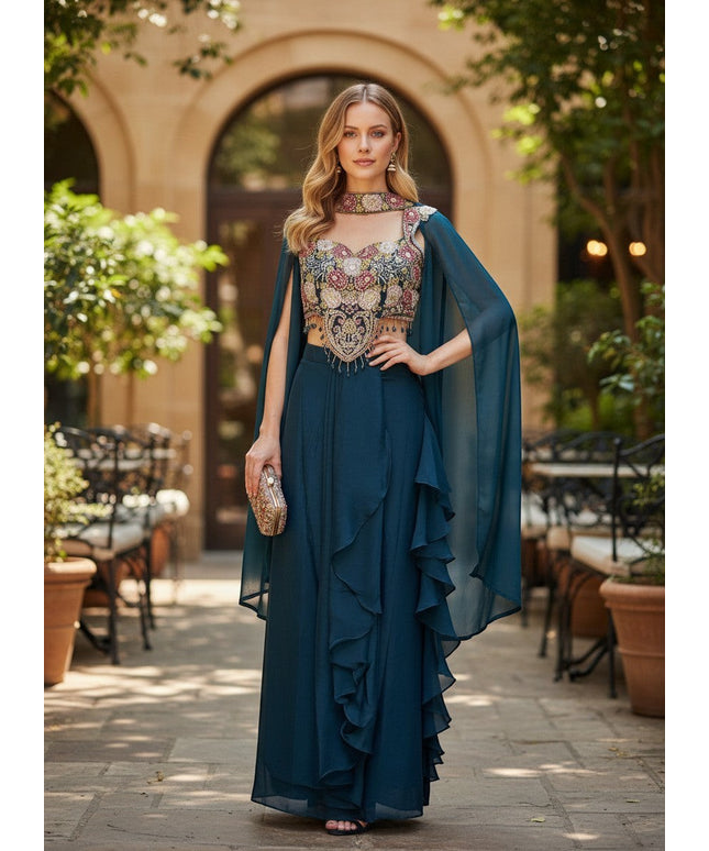 Kurti Connection USA teal embellished crop top and skirt set with floral embroidery, beaded fringe, and cape overlay.