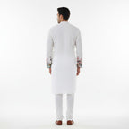 Kurti Connection USA white embroidered kurta with floral and crane printed sleeves and hem for men.